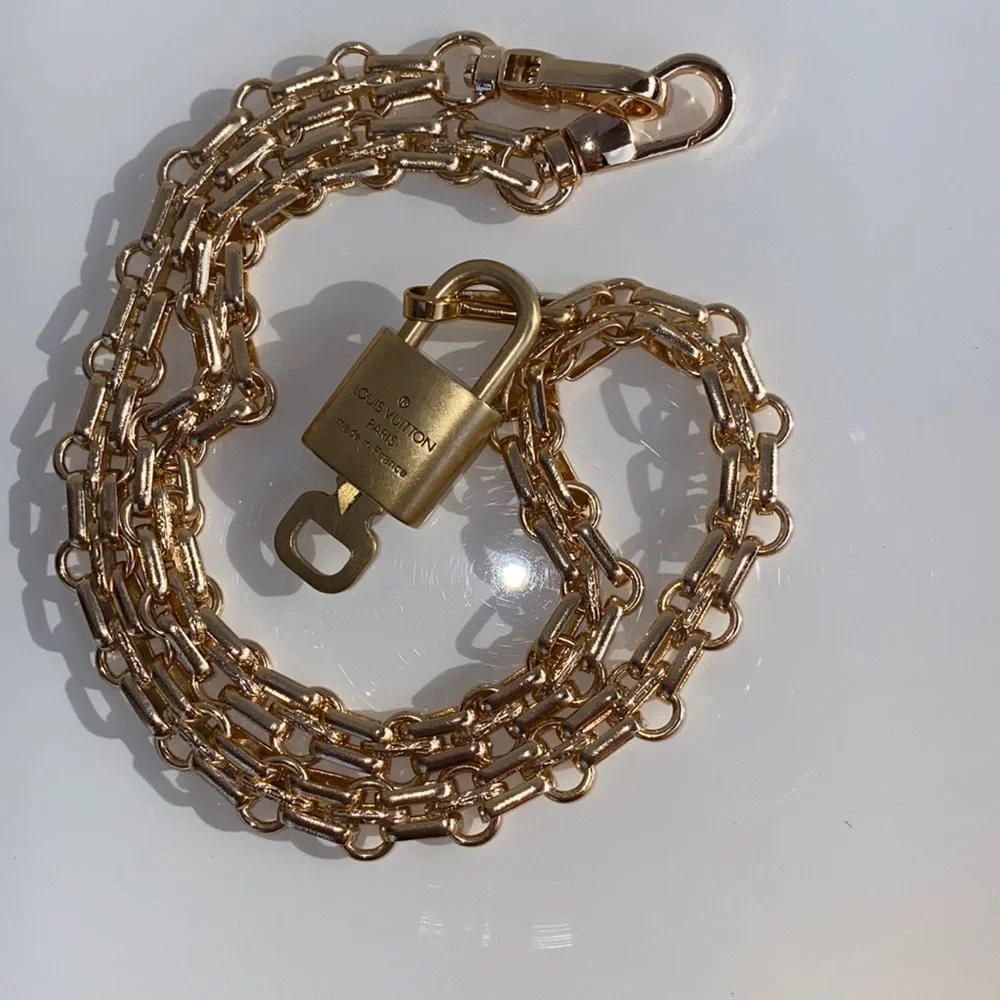 Authentic Louis Vuitton Lock and Key Set on a Chain. - Picture 4 of 10
